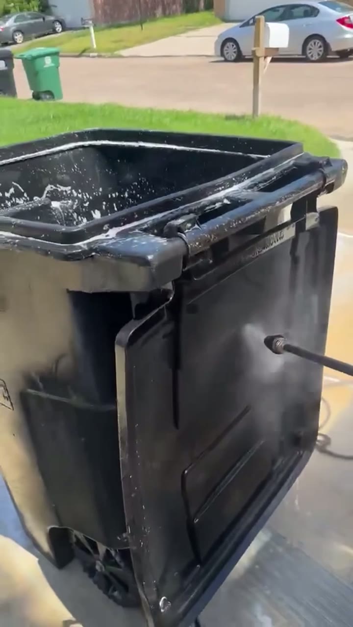 Curbside deep clean — pressure rinse, lid to wheels